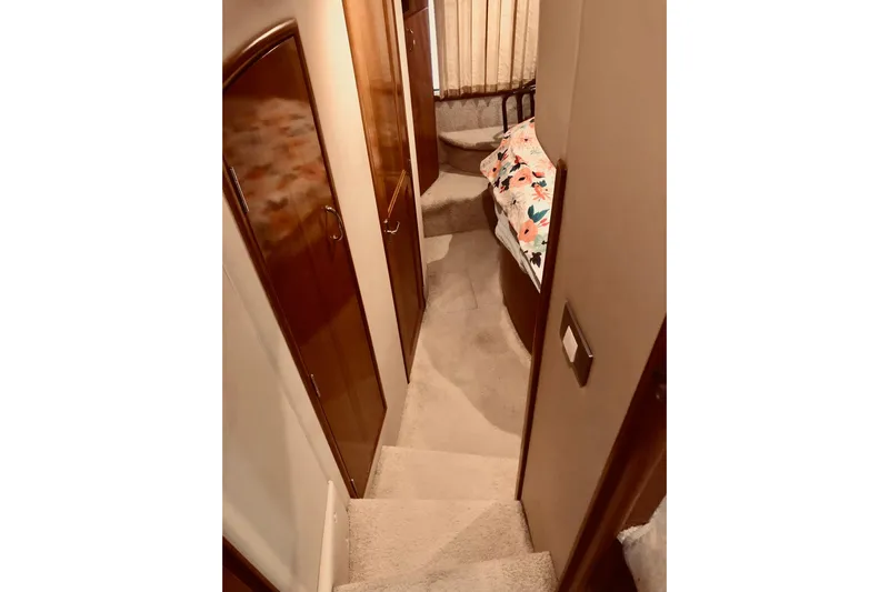 Fire Away Yacht Photos Pics Interior of 2005 Carver 444 Cockpit Motor Yacht with carpeted stairs and cozy cabin.