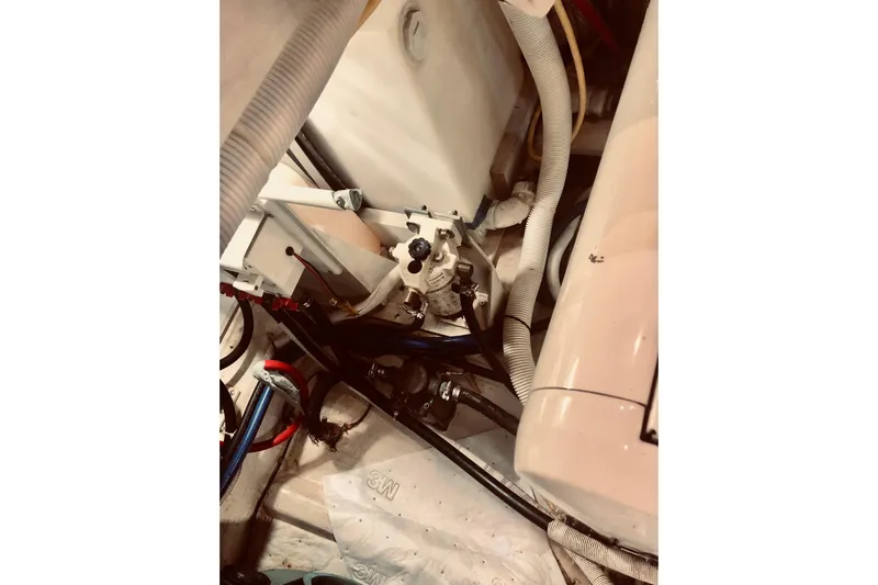 Fire Away Yacht Photos Pics Engine room of 2005 Carver 444 Cockpit Motor Yacht with visible hoses and components.