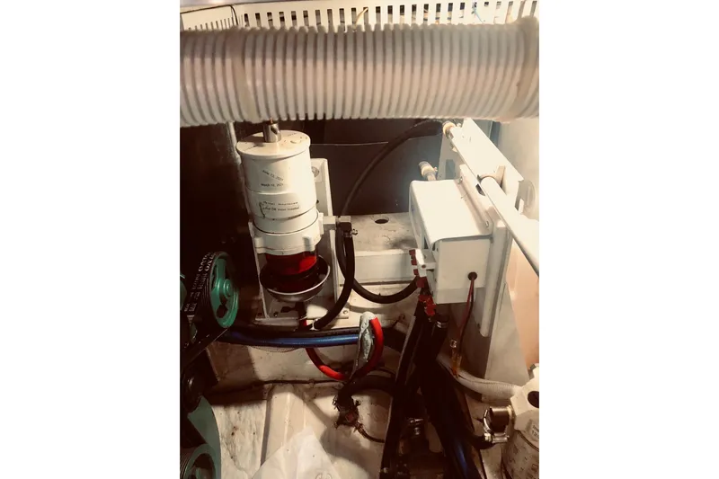 Fire Away Yacht Photos Pics Engine compartment of 2005 Carver 444 Cockpit Motor Yacht, showcasing mechanical components.