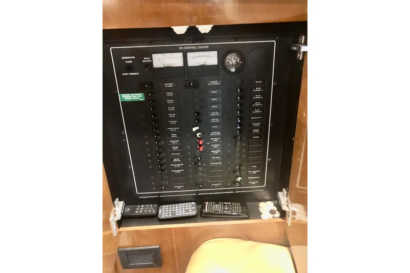 Fire Away Yacht Photos Pics Control panel of 2005 Carver 444 Cockpit Motor Yacht with various switches and meters.