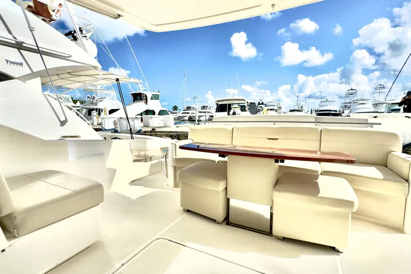  Yacht Photos Pics Luxurious 2020 Tiara Yachts F53 Flybridge with spacious seating and marina view.