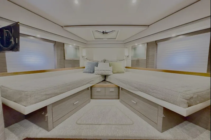  Yacht Photos Pics Luxurious 2020 Tiara Yachts F53 Flybridge cabin interior with twin beds and modern decor.