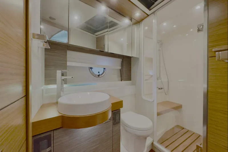  Yacht Photos Pics Luxurious bathroom in 2020 Tiara Yachts F53 Flybridge with modern fixtures and elegant design.