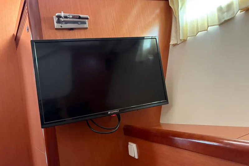  Yacht Photos Pics Flat-screen TV mounted in a 2008 Beneteau 49 yacht interior.