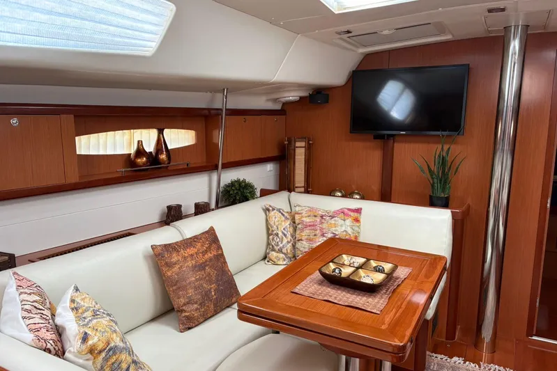  Yacht Photos Pics Luxurious interior of a 2008 Beneteau 49 yacht with elegant seating and decor.