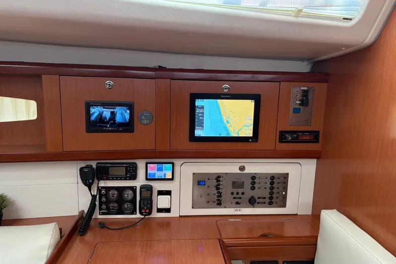  Yacht Photos Pics Interior navigation panel of a 2008 Beneteau 49 yacht with electronic displays and controls.