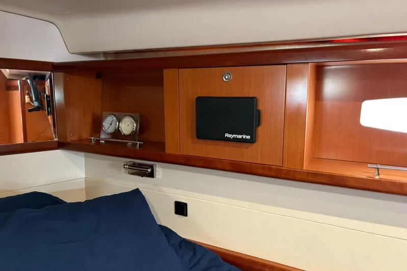  Yacht Photos Pics Interior cabin of 2008 Beneteau 49 yacht with wooden cabinetry and Raymarine equipment.