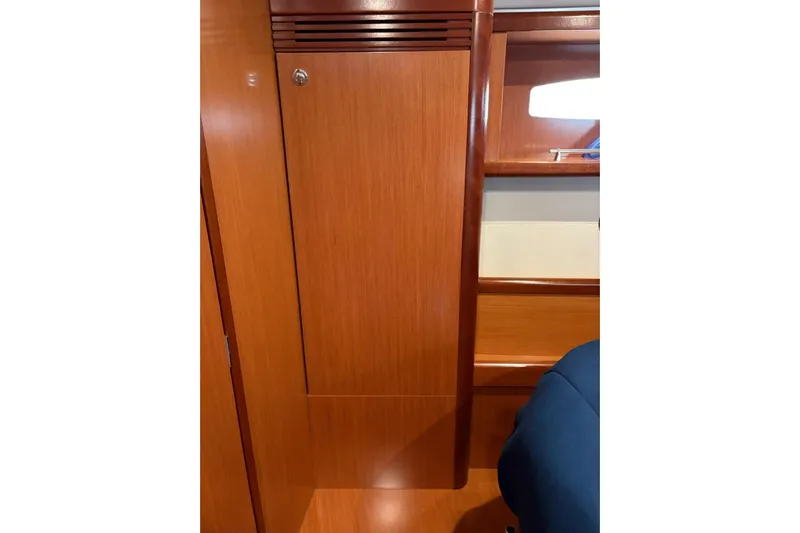  Yacht Photos Pics Interior of 2008 Beneteau 49 yacht, featuring wooden cabinetry and seating.
