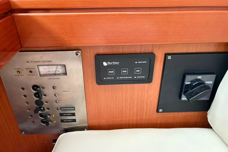  Yacht Photos Pics Control panel of a 2008 Beneteau 49 yacht, featuring AC power center and switches.