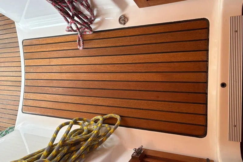  Yacht Photos Pics Teak deck of 2008 Beneteau 49 sailboat with coiled ropes.