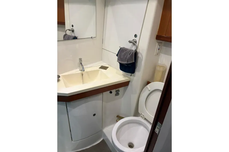  Yacht Photos Pics Bathroom interior of a 2008 Beneteau 49 yacht, featuring sink and toilet.