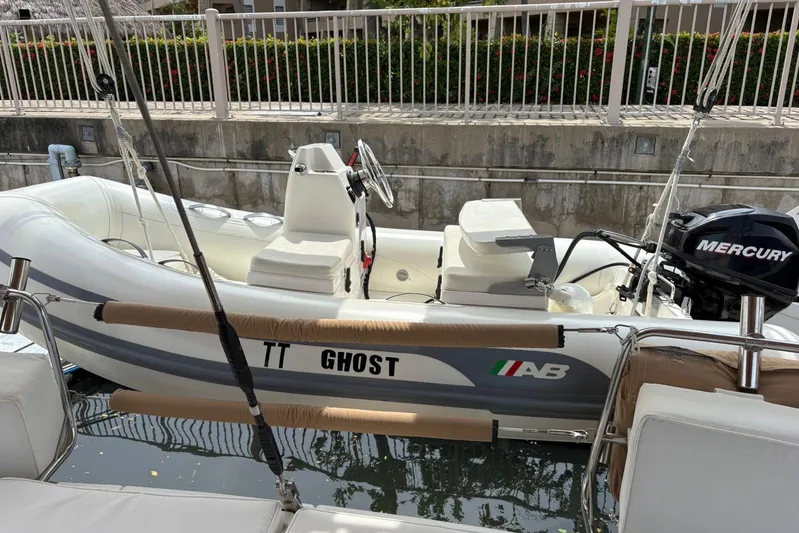  Yacht Photos Pics Inflatable boat with Mercury engine docked beside a Beneteau 49, 2008 model.
