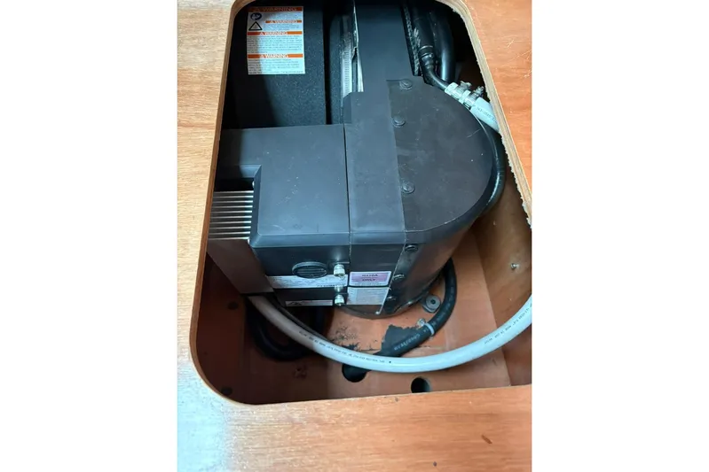  Yacht Photos Pics Engine compartment of a 2008 Beneteau 49 sailboat, showcasing mechanical components.