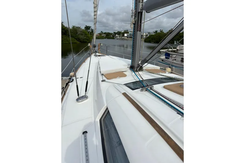  Yacht Photos Pics 2008 Beneteau 49 sailboat deck with rigging and scenic waterway view.