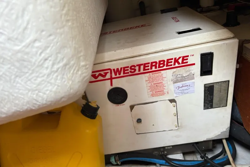  Yacht Photos Pics Westerbeke generator in a 2008 Beneteau 49 yacht engine room, with yellow diesel container.