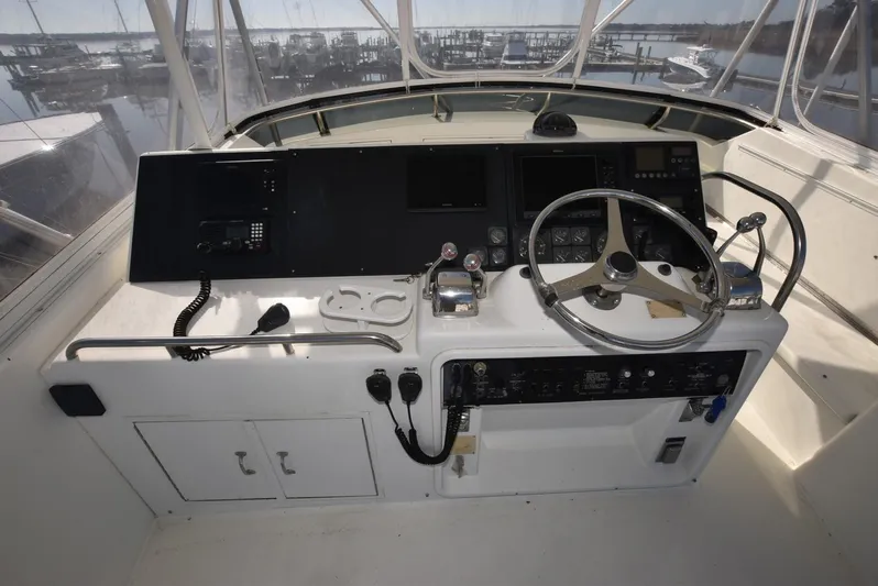 Crazy Train Yacht Photos Pics 1996 Hatteras 50 Convertible yacht helm with steering wheel and control panel.