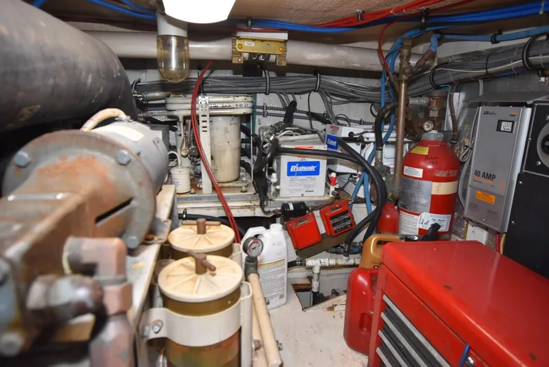 Crazy Train Yacht Photos Pics Engine room of 1996 Hatteras 50 Convertible with equipment and wiring.