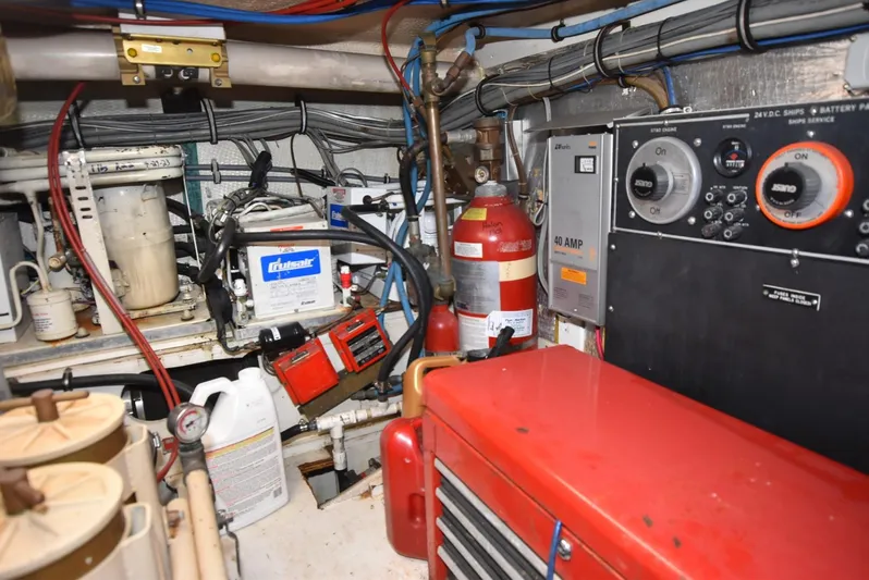 Crazy Train Yacht Photos Pics Engine room of 1996 Hatteras 50 Convertible with equipment and wiring.