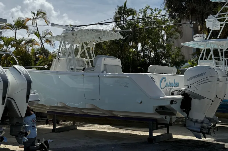  Yacht Photos Pics 2022 SeaVee 322z boat with twin Mercury engines, docked outdoors.