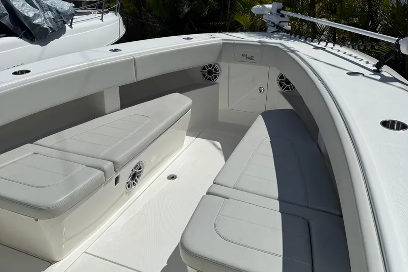  Yacht Photos Pics 2022 SeaVee 322z boat interior with white cushioned seating and speakers.