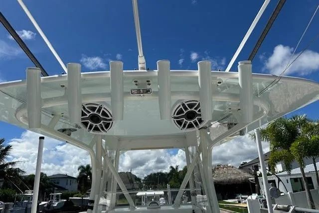 Reel Craft Yacht Photos Pics 2024 SeaVee 340Z boat with speakers and rod holders under a clear blue sky.