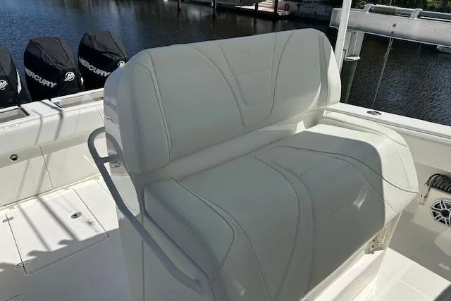 Reel Craft Yacht Photos Pics 2024 SeaVee 340Z boat with white seating and Mercury engines in the background.