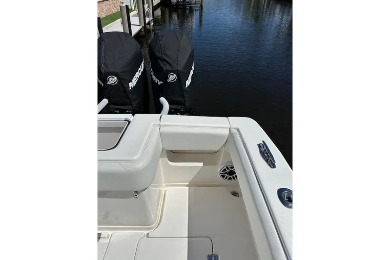 Reel Craft Yacht Photos Pics 2024 SeaVee 340Z boat with dual Mercury engines, docked by the water.