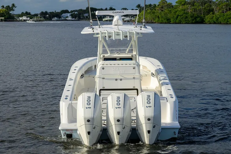 Reel Craft Yacht Photos Pics 2024 SeaVee 340Z boat with four powerful outboard engines on calm water.