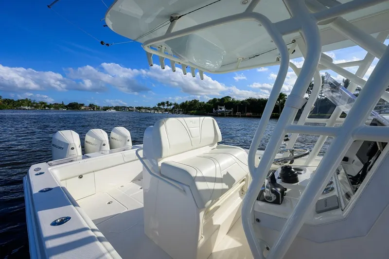 Reel Craft Yacht Photos Pics 2024 SeaVee 340Z boat with triple Mercury engines on a sunny day.