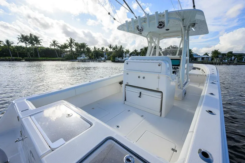 Reel Craft Yacht Photos Pics 2024 SeaVee 340Z boat with spacious deck, sleek design, and modern features on calm water.
