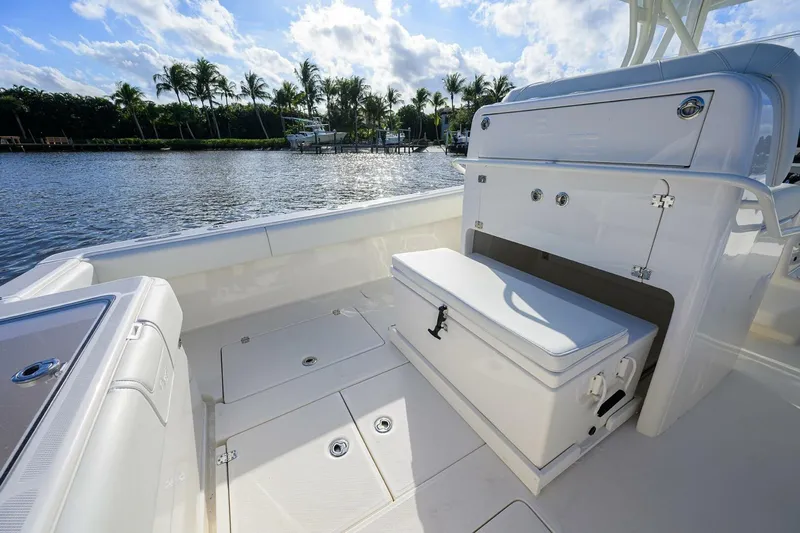 Reel Craft Yacht Photos Pics 2024 SeaVee 340Z boat interior with storage, docked by a scenic waterfront.