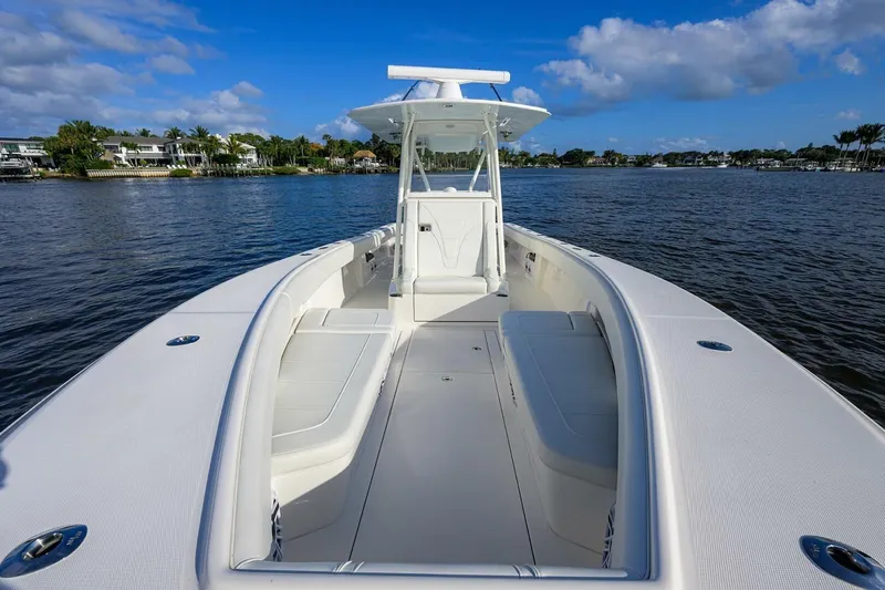Reel Craft Yacht Photos Pics 2024 SeaVee 340Z boat on calm water, showcasing spacious deck and seating.