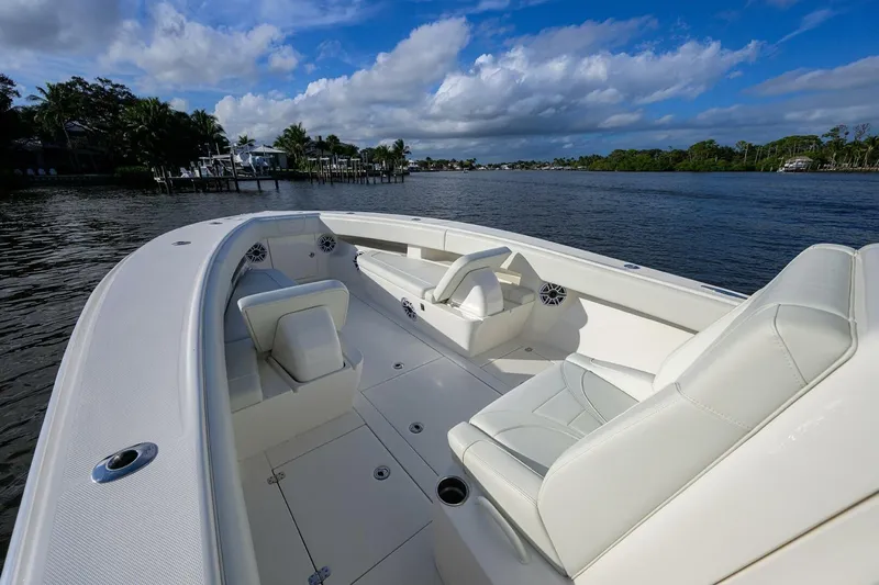 Reel Craft Yacht Photos Pics 2024 SeaVee 340Z boat interior with white seating, on a calm river.
