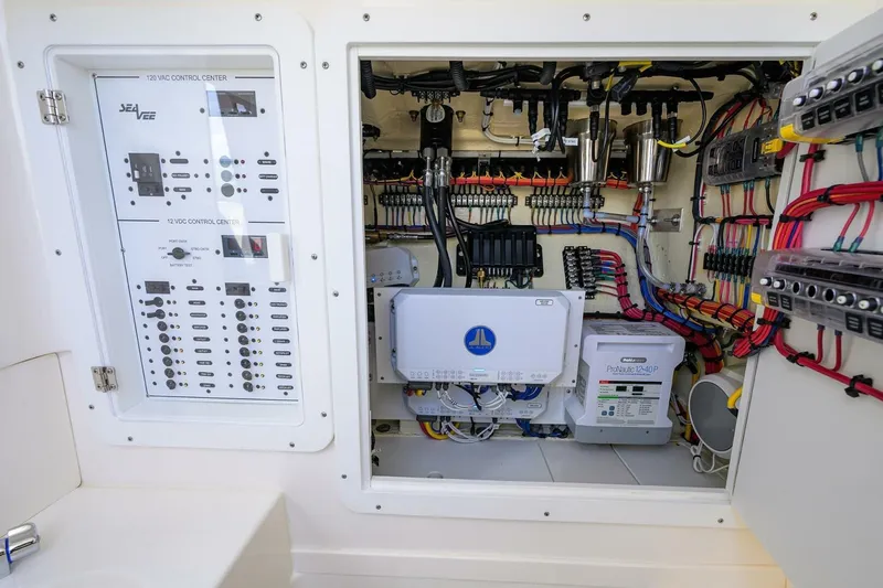 Reel Craft Yacht Photos Pics Electrical control panel of 2024 SeaVee 340Z boat, showcasing wiring and systems.