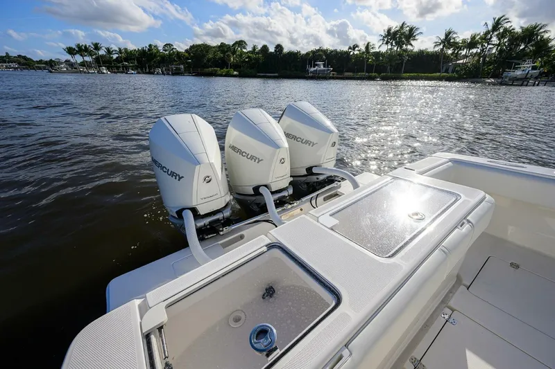 Reel Craft Yacht Photos Pics 2024 SeaVee 340Z boat with triple Mercury engines on a sunny day.