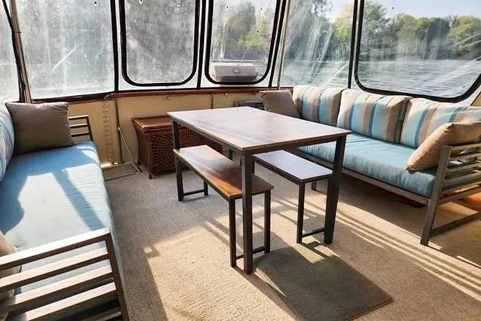  Yacht Photos Pics Interior of 1988 Hatteras 43 Motor Yacht with cozy seating and dining area.