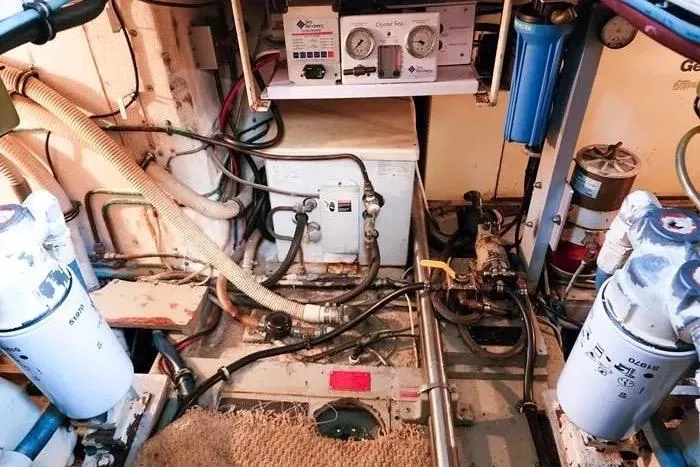  Yacht Photos Pics Engine room of 1988 Hatteras 43 Motor Yacht with various mechanical components.