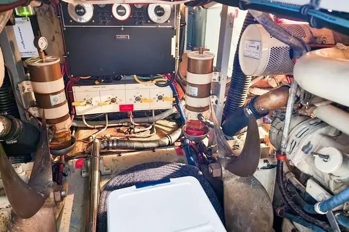  Yacht Photos Pics Engine room of 1988 Hatteras 43 Motor Yacht, showcasing mechanical components and gauges.