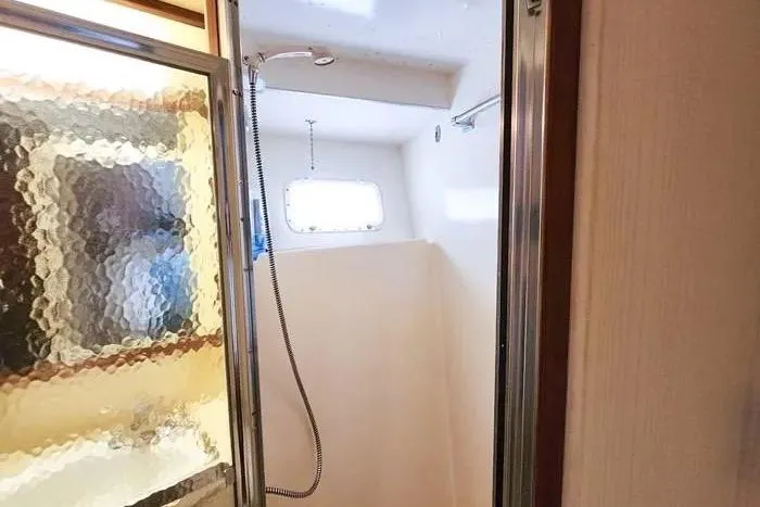  Yacht Photos Pics Shower area in 1988 Hatteras 43 Motor Yacht with frosted glass door.