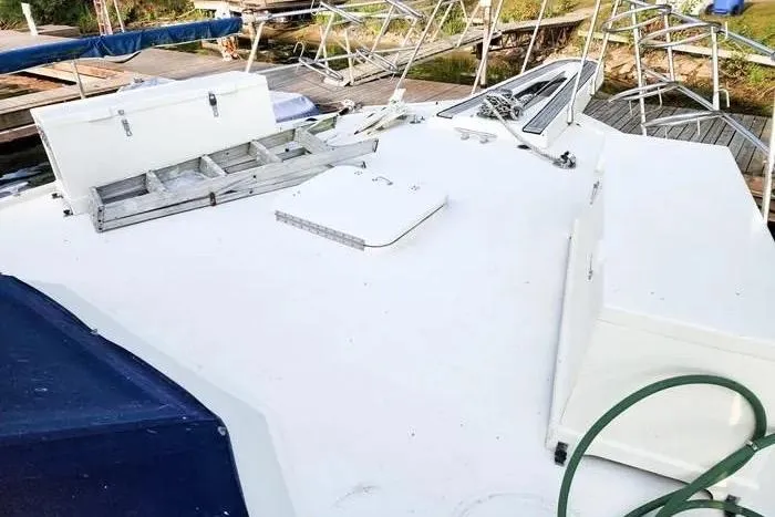  Yacht Photos Pics 1988 Hatteras 43 Motor Yacht deck with storage boxes and railing.