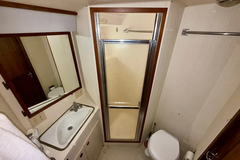  Yacht Photos Pics Bathroom interior of 1988 Hatteras 43 Motor Yacht with shower and sink.