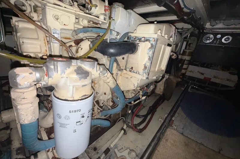  Yacht Photos Pics Engine room of 1988 Hatteras 43 Motor Yacht, showcasing mechanical components and filter.