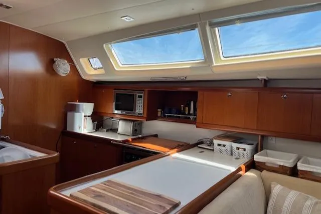 Comfort Zone Yacht Photos Pics Interior of 2007 Beneteau 49 yacht with modern kitchen and skylights.