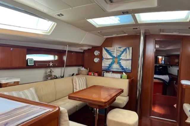 Comfort Zone Yacht Photos Pics Luxurious interior of a 2007 Beneteau 49 yacht with elegant seating and decor.