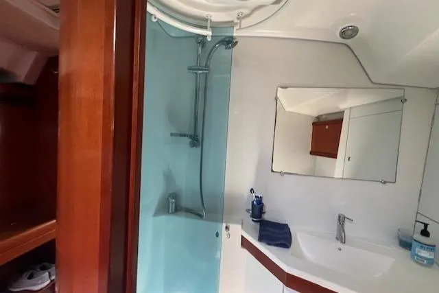 Comfort Zone Yacht Photos Pics Bathroom interior of 2007 Beneteau 49 yacht with shower and sink.