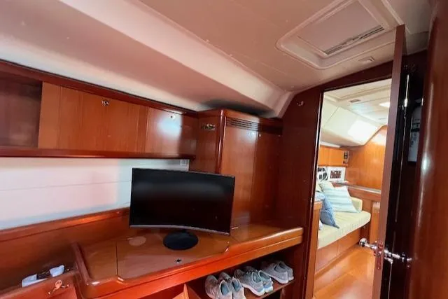 Comfort Zone Yacht Photos Pics Luxurious interior of a 2007 Beneteau 49 yacht with wood finish and modern amenities.