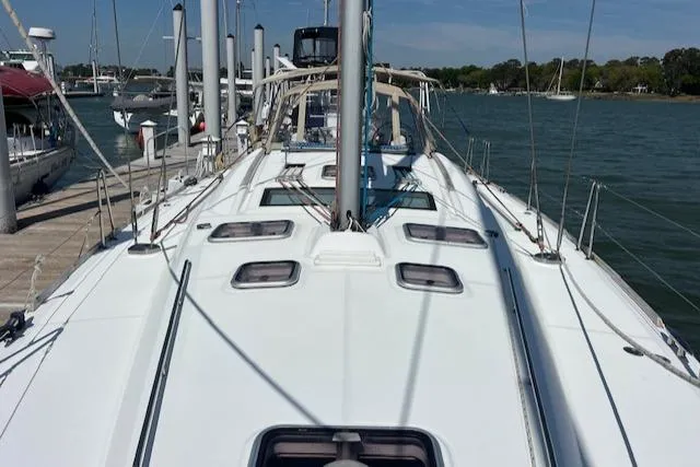 Comfort Zone Yacht Photos Pics 2007 Beneteau 49 sailboat docked, showcasing sleek deck design and marina setting.