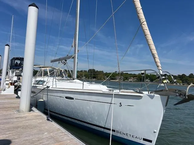 Comfort Zone Yacht Photos Pics Sailboat Beneteau 49, 2007 model, docked at marina under clear blue sky.