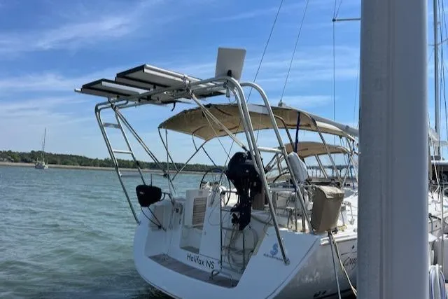Comfort Zone Yacht Photos Pics Beneteau 49 sailboat, 2007 model, docked in Halifax, NS, with solar panels and canopy.
