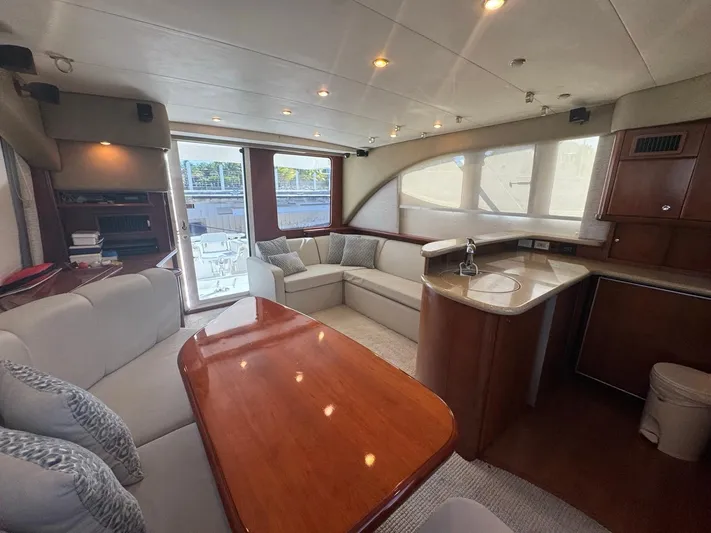  Yacht Photos Pics Luxurious interior of 2009 Silverton 45 Convertible yacht with elegant seating and modern kitchen.